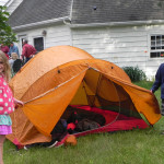 picture of kids and a tent in backyard