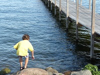 Boy Playing by Dock