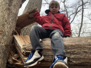 Boy on a log