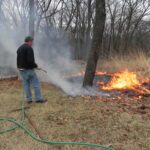 watering down a small fire