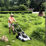 woman with EGO lawnmower