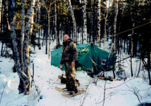 Man camping in winter