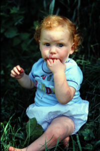 child eating berries