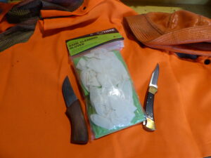 Gloves and knives for cleaning deer.