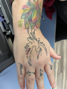 Tattoo of Phoenix. Names on fingers