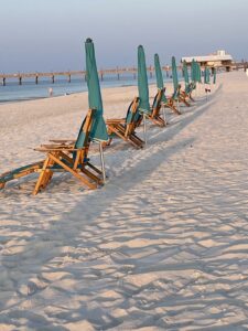 Beach chairs and umbrellas along the shore.