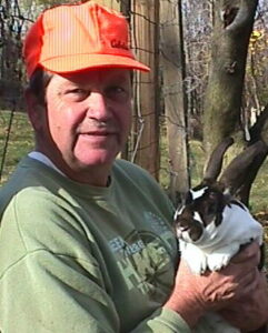 Man holding a Rex rabbit