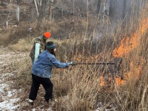 Tending a prairie burn