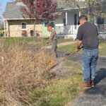 Two men pull fire in labyirnth.