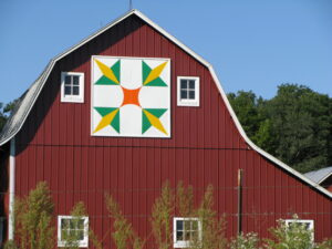 Barn Quilt on red barn.