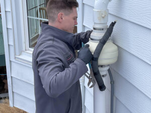 Radon specialist replaces worn radon machine.