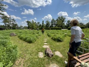 Woman watches other walkers in Phoenix Harmony Labyrinth