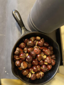 Cast iron pan with roasted chestnuts.
